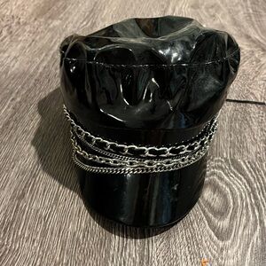 black faux leather newsboy or baker boy cap with silver chain details